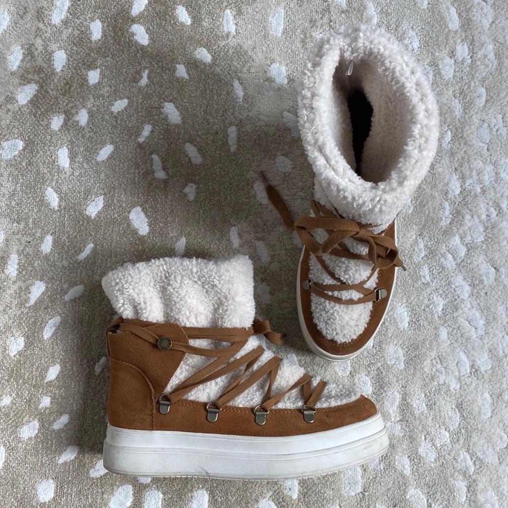 J Slides shearling winter boots.